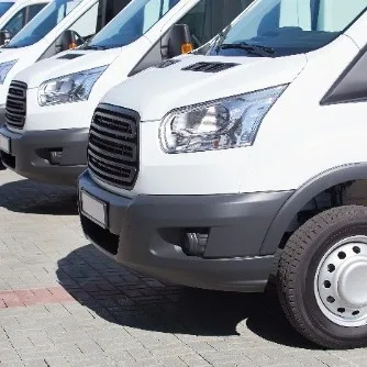 Row of clean business fleet vans